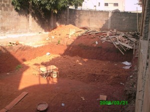 The swimming pool located at the back of the building under construction swimming pool site