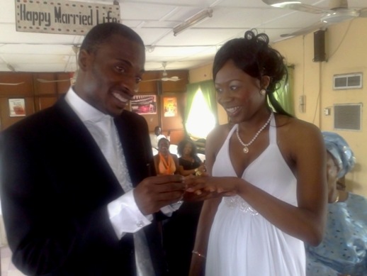 the couple exchanging vows at the Surulere registry The couple exchanging wedding rings at the Surulere registry in Lagos last year