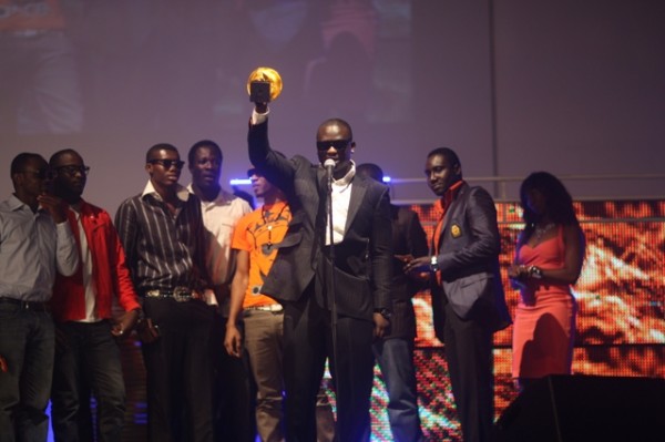 wande receives one of his awards...